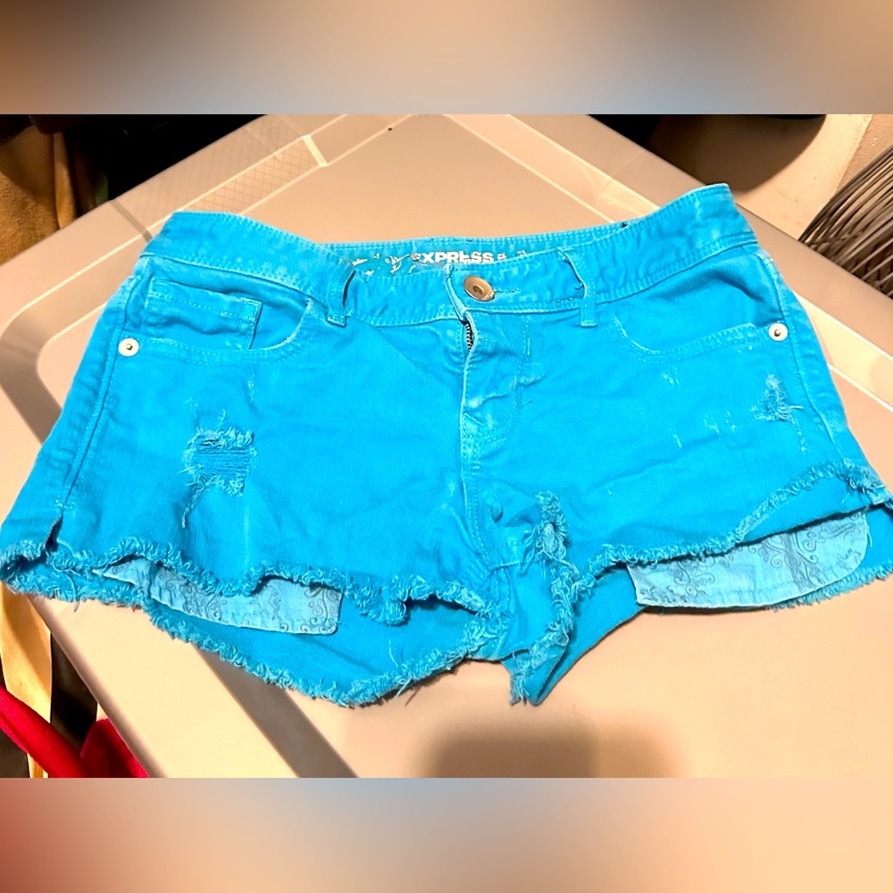 Express teal mid rise distressed shorts